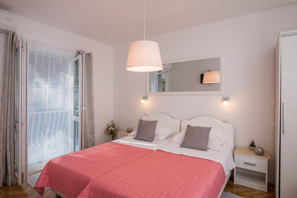 Postel nebo postele na pokoji v ubytování Apartments Lile