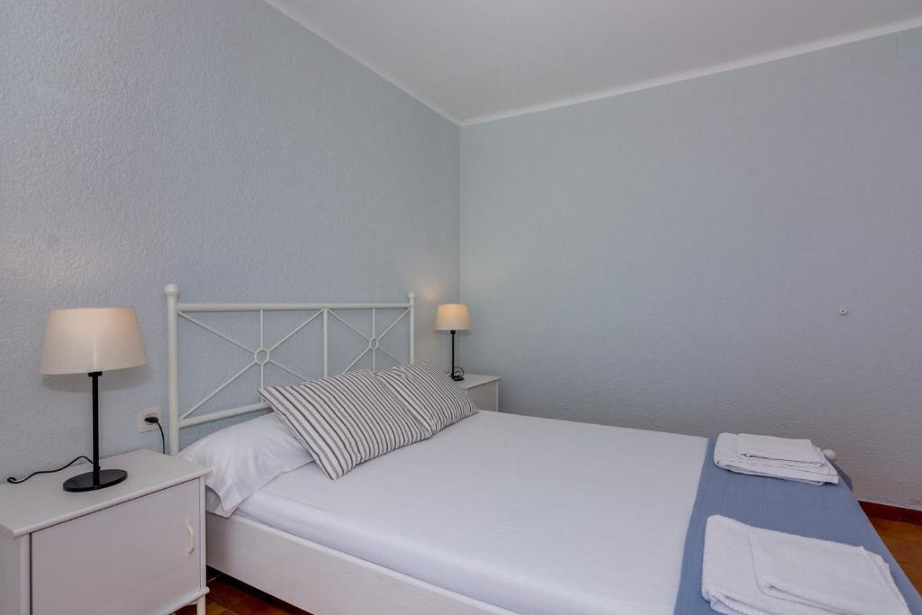 Posteľ alebo postele v izbe v ubytovaní HomeHolidaysRentals Etoile