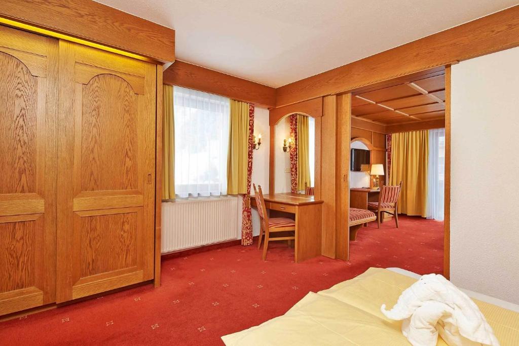 Postel nebo postele na pokoji v ubytování Hotel Alt Vent Tyrol