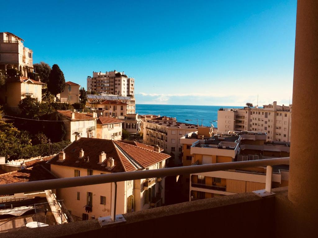 une vue depuis le balcon d'une ville dans l'établissement By the sea, calm studio with terrace, near Monaco, à Beausoleil