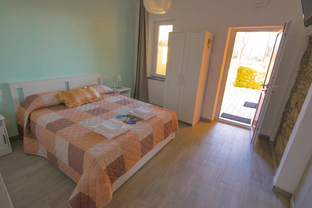 Letto o letti in una camera di I TRE GRAPPOLI