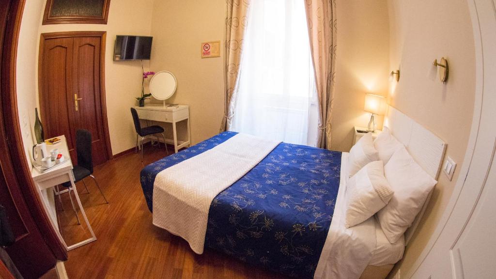 Postel nebo postele na pokoji v ubytování Hotel Martino Ai Monti