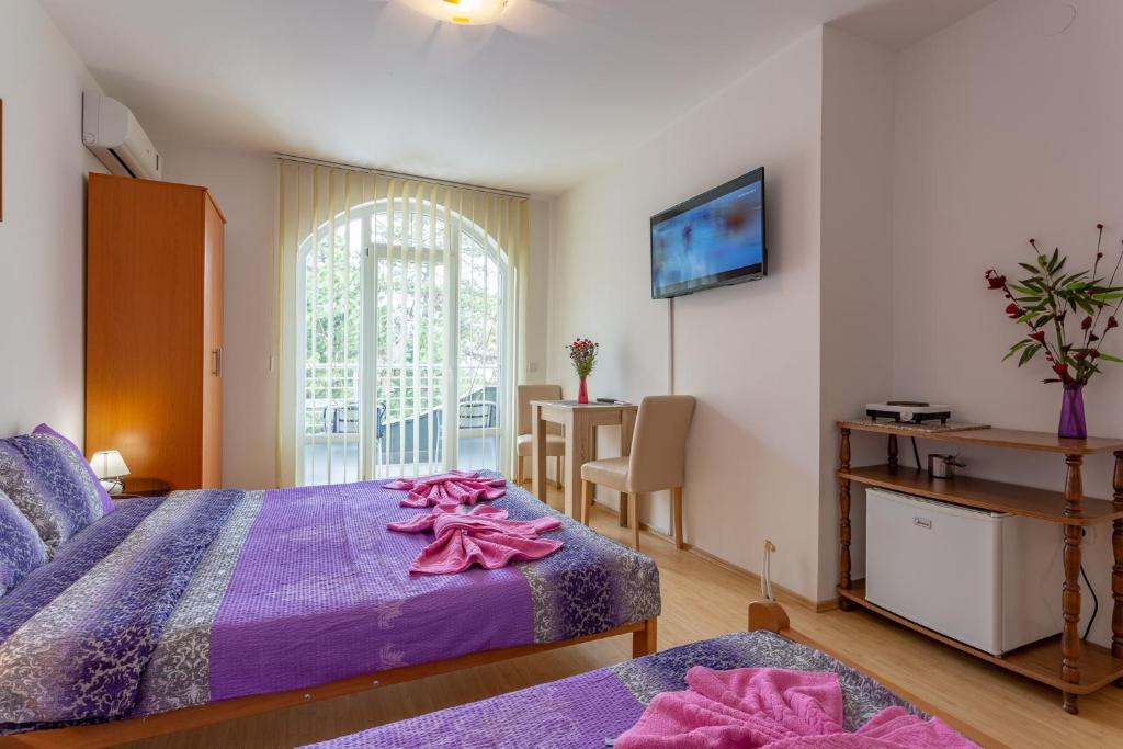 Letto o letti in una camera di Guesthouse Sunny