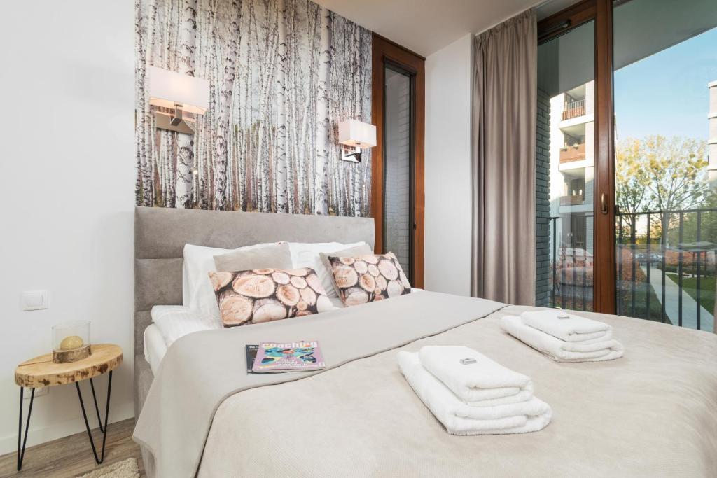 Posteľ alebo postele v izbe v ubytovaní Prime Apartments
