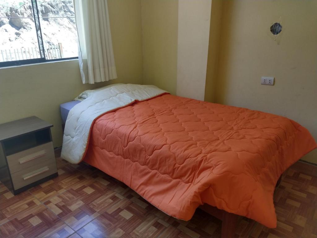 מיטה או מיטות בחדר ב-Hospedaje T&T