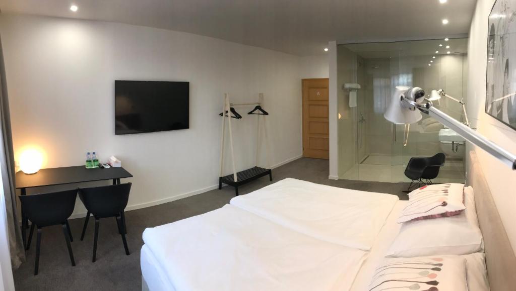 Postel nebo postele na pokoji v ubytování Rozmaryn Hotel B&B