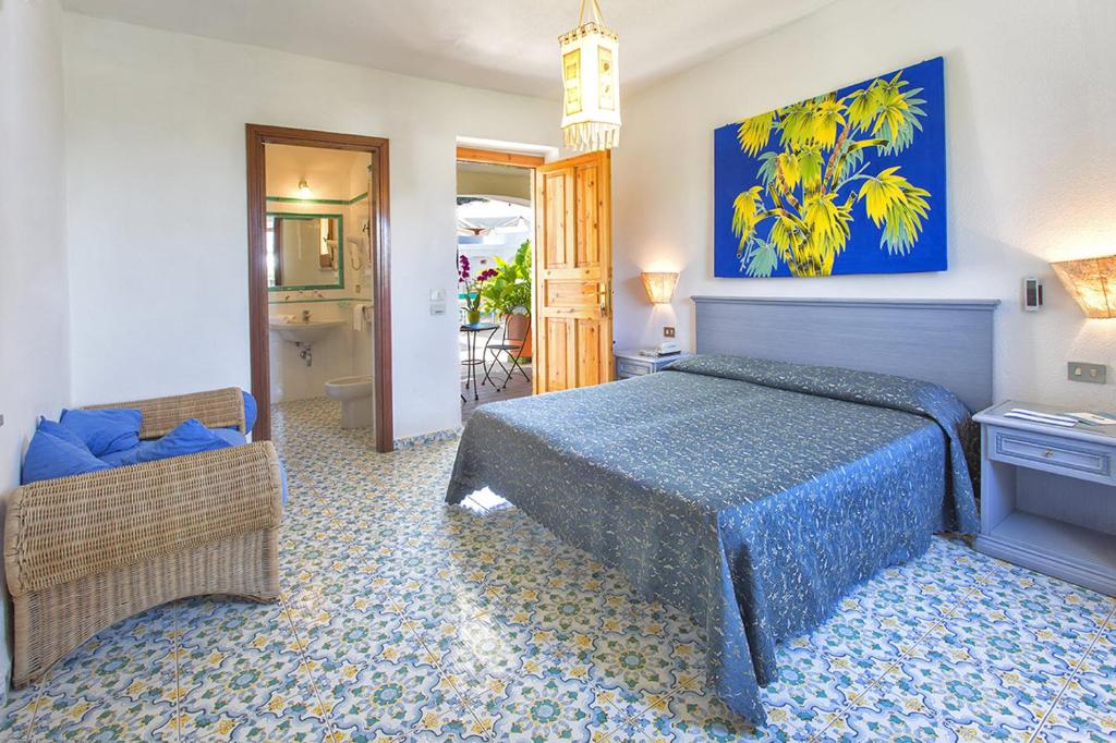 Cama ou camas em um quarto em Hotel La Scogliera