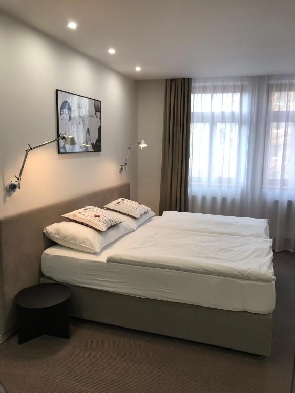 Postel nebo postele na pokoji v ubytování Rozmaryn Hotel B&B