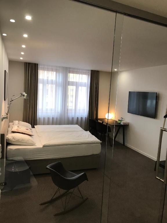 Postel nebo postele na pokoji v ubytování Rozmaryn Hotel B&B