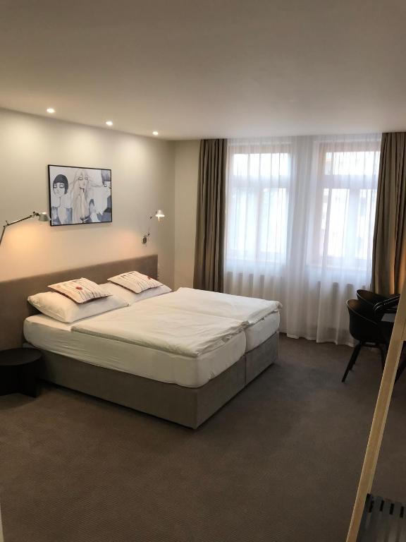 Postel nebo postele na pokoji v ubytování Rozmaryn Hotel B&B