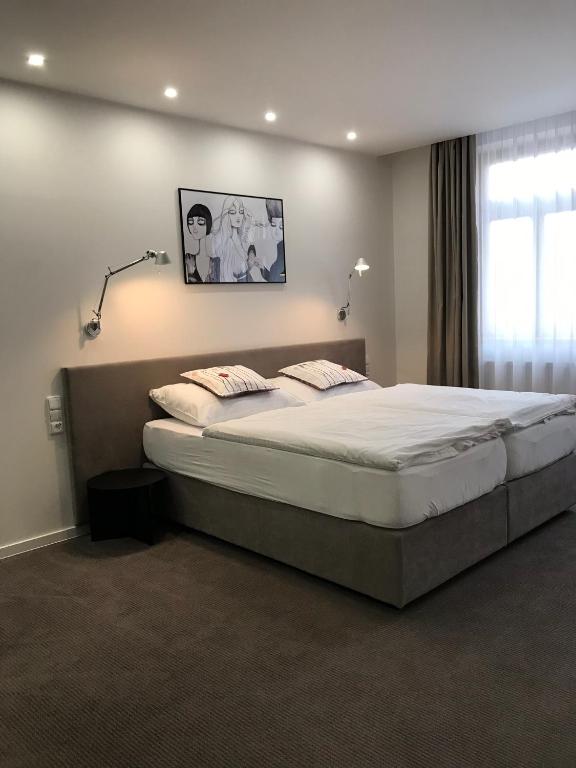 Postel nebo postele na pokoji v ubytování Rozmaryn Hotel B&B