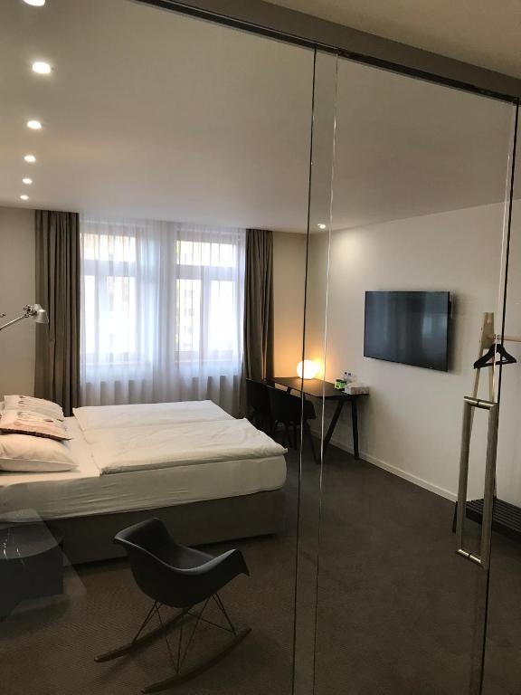Postel nebo postele na pokoji v ubytování Rozmaryn Hotel B&B