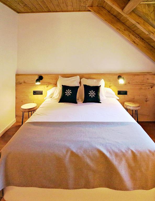 Postel nebo postele na pokoji v ubytování Hotel Lo Paller