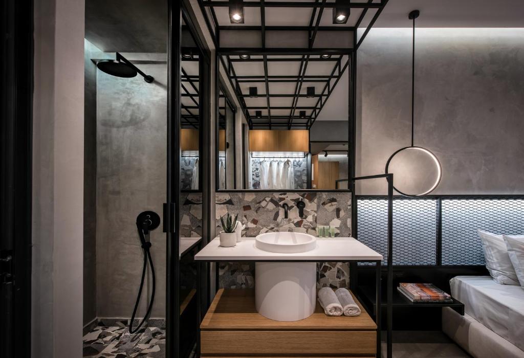 Posteľ alebo postele v izbe v ubytovaní King's Blue, Urban Suites