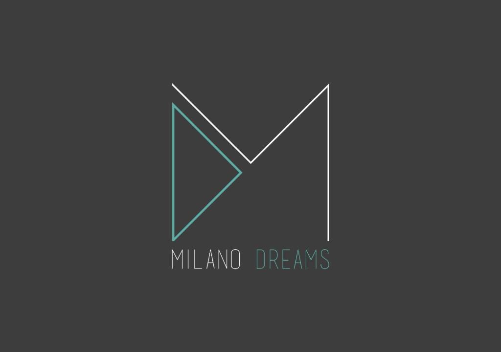 een logo voor melkboer met een letter n bij Milano Dreams in Milaan