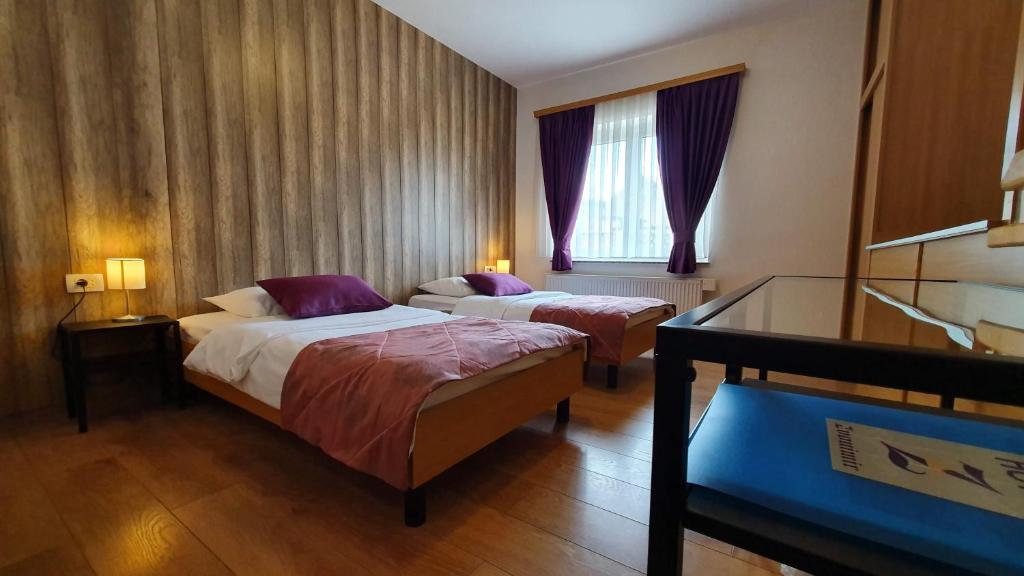 Postel nebo postele na pokoji v ubytování Hotel Zvonimir
