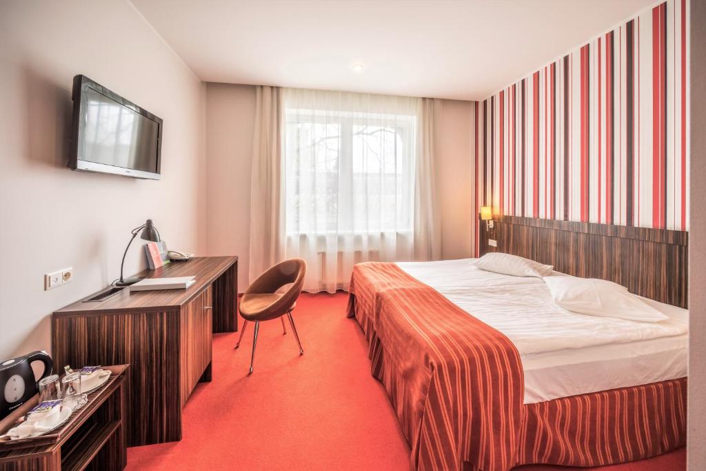Gulta vai gultas numurā naktsmītnē Rija VEF Hotel with FREE Parking