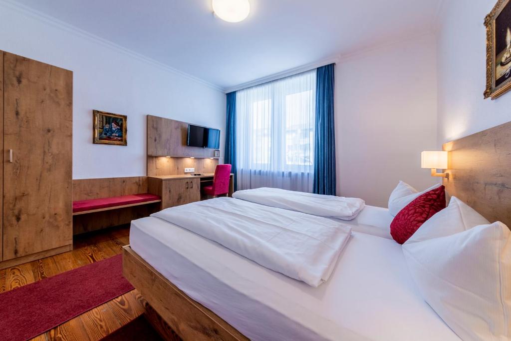 Letto o letti in una camera di Hotel Krone