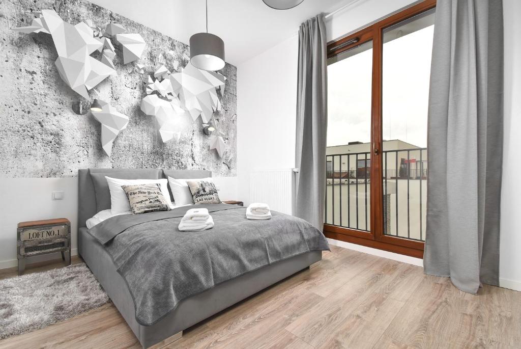 Posteľ alebo postele v izbe v ubytovaní Prime Apartments