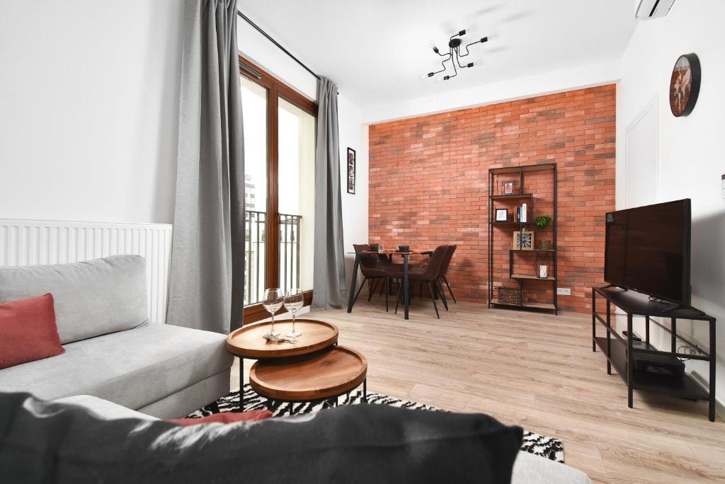 Televízia a/alebo spoločenská miestnosť v ubytovaní Prime Apartments