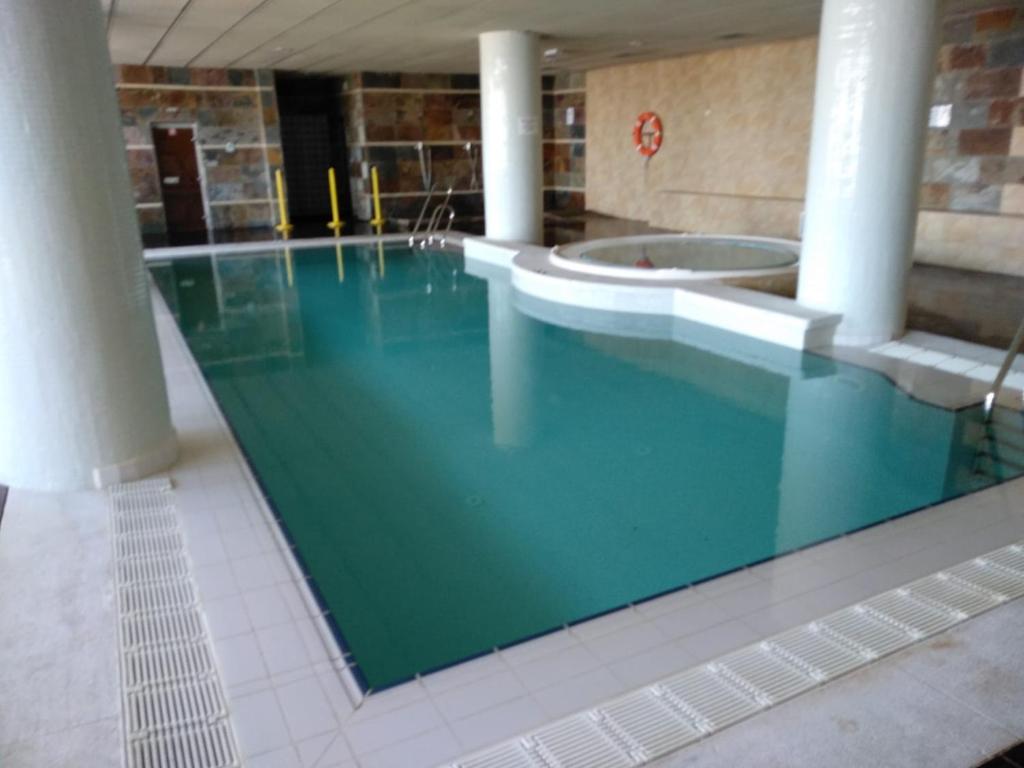 a large swimming pool in a building at Maribel Arttyco in Sierra Nevada