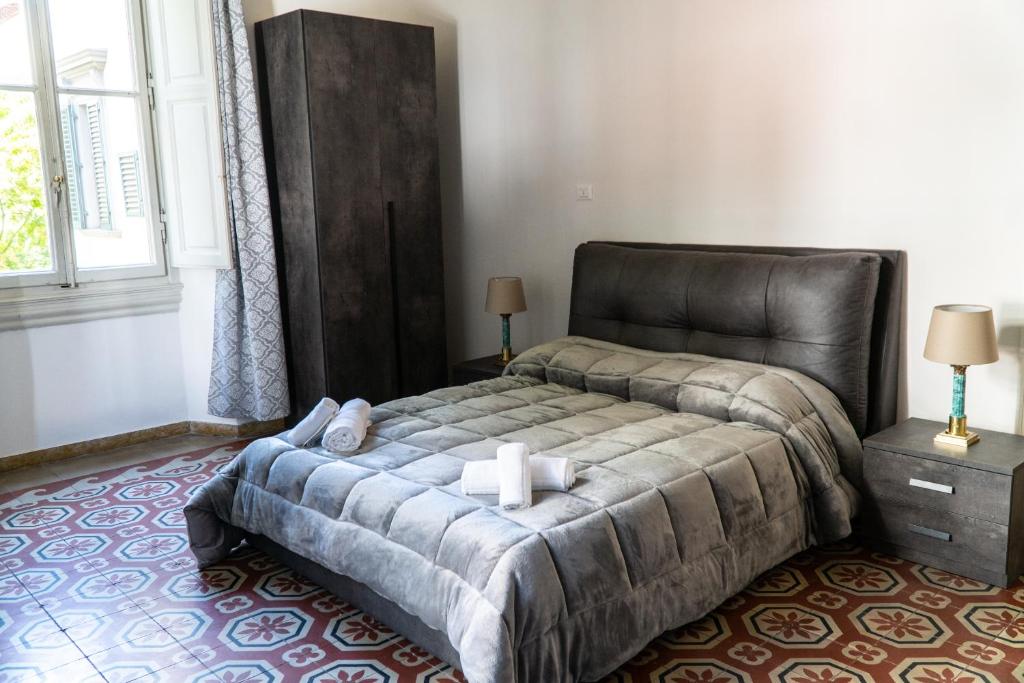 Ένα ή περισσότερα κρεβάτια σε δωμάτιο στο Residence Le Cure