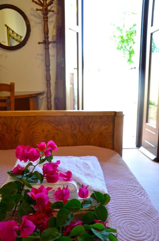 A bed or beds in a room at Kamara Stone House