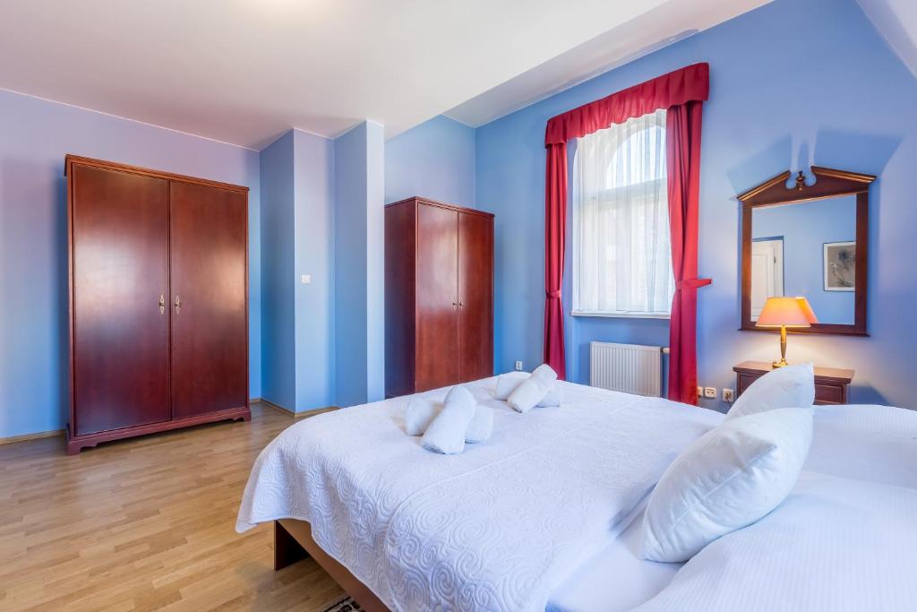 Postel nebo postele na pokoji v ubytování Hotel U Rytíře