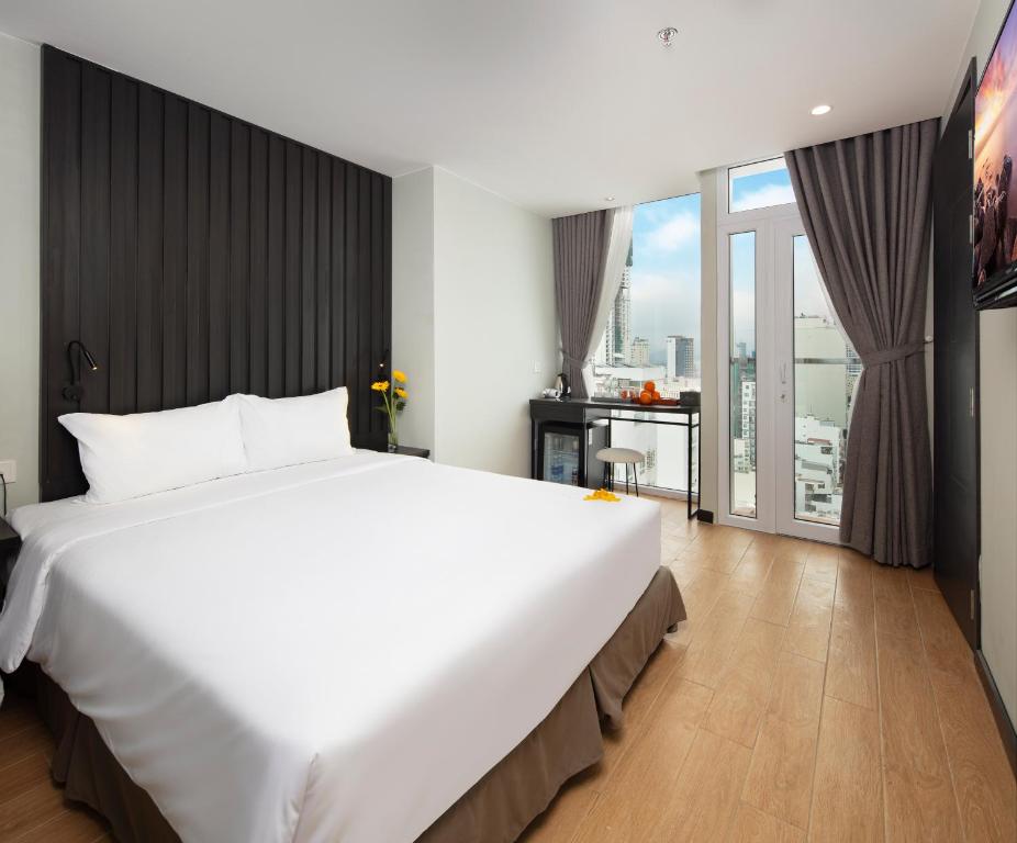 Agnes Nha Trang Hotel tesisinde bir odada yatak veya yataklar