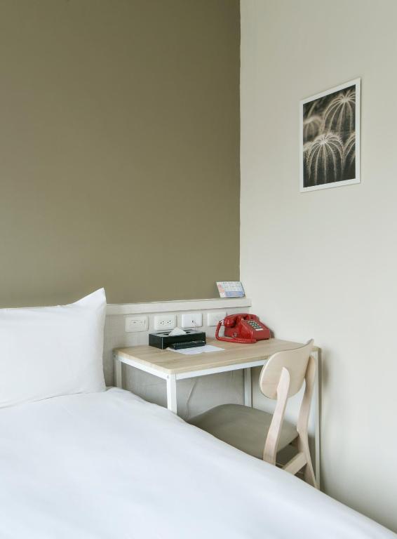 Postel nebo postele na pokoji v ubytování Raise Hotel Taichung