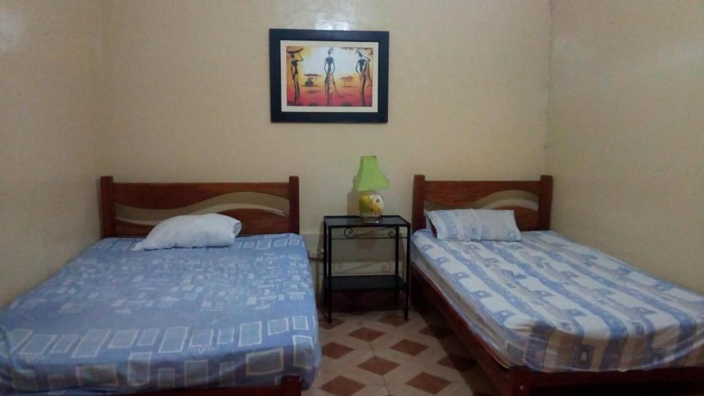 Postel nebo postele na pokoji v ubytování Hostal Virrey & Tours