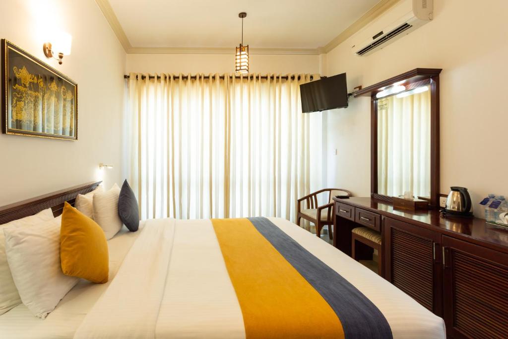 Postel nebo postele na pokoji v ubytování Hotel Yo Kandy