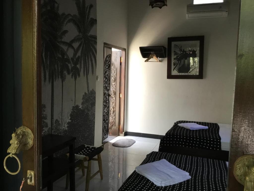 Postel nebo postele na pokoji v ubytování Gili Nyepi