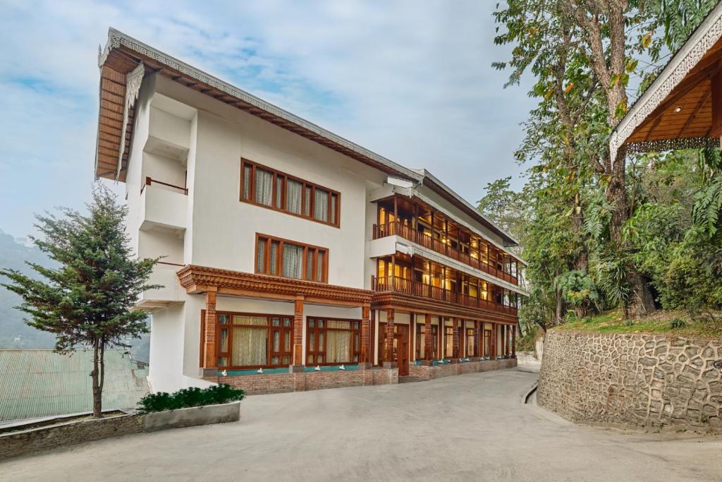 an exterior view of a building with windows at Sterling Gangtok Orange Village in Gangtok