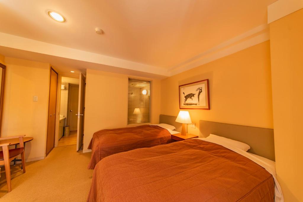 Postel nebo postele na pokoji v ubytování Fuji Premium Resort