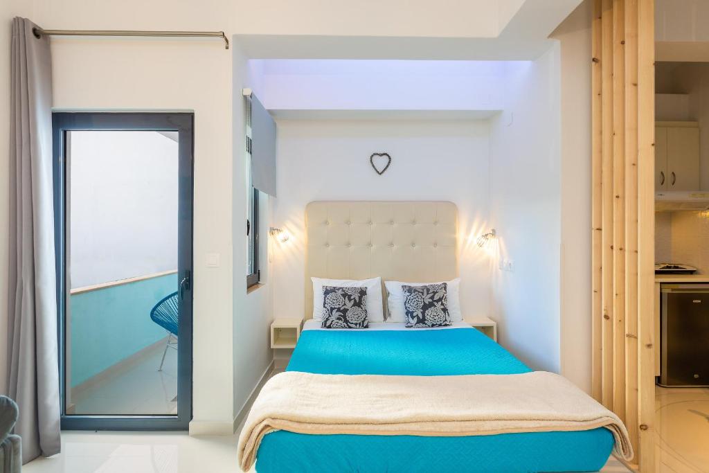 Posteľ alebo postele v izbe v ubytovaní Rethymno Hills Apartments