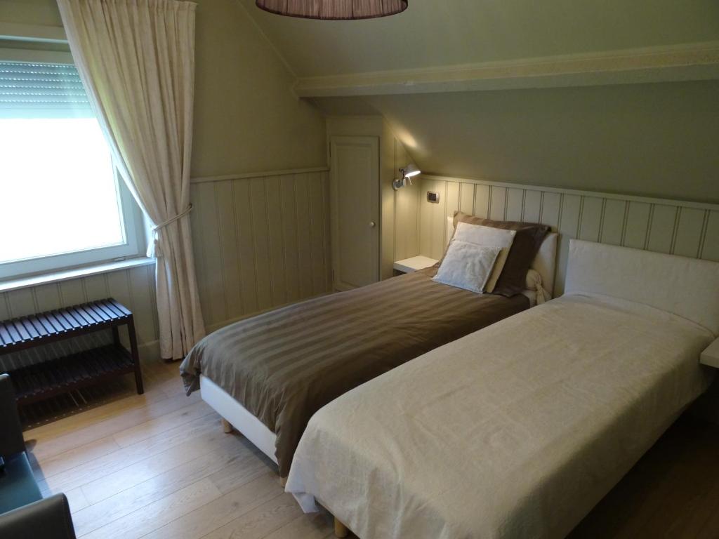 Postel nebo postele na pokoji v ubytování B & B DE SERAFIJN