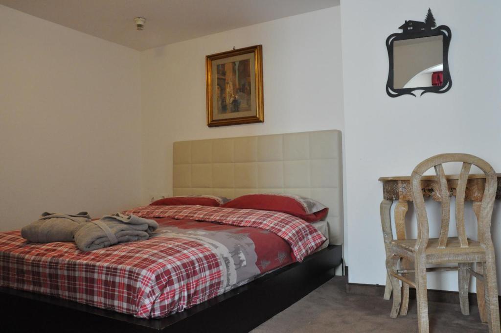 Postel nebo postele na pokoji v ubytování Alpenlife Hotel Someda