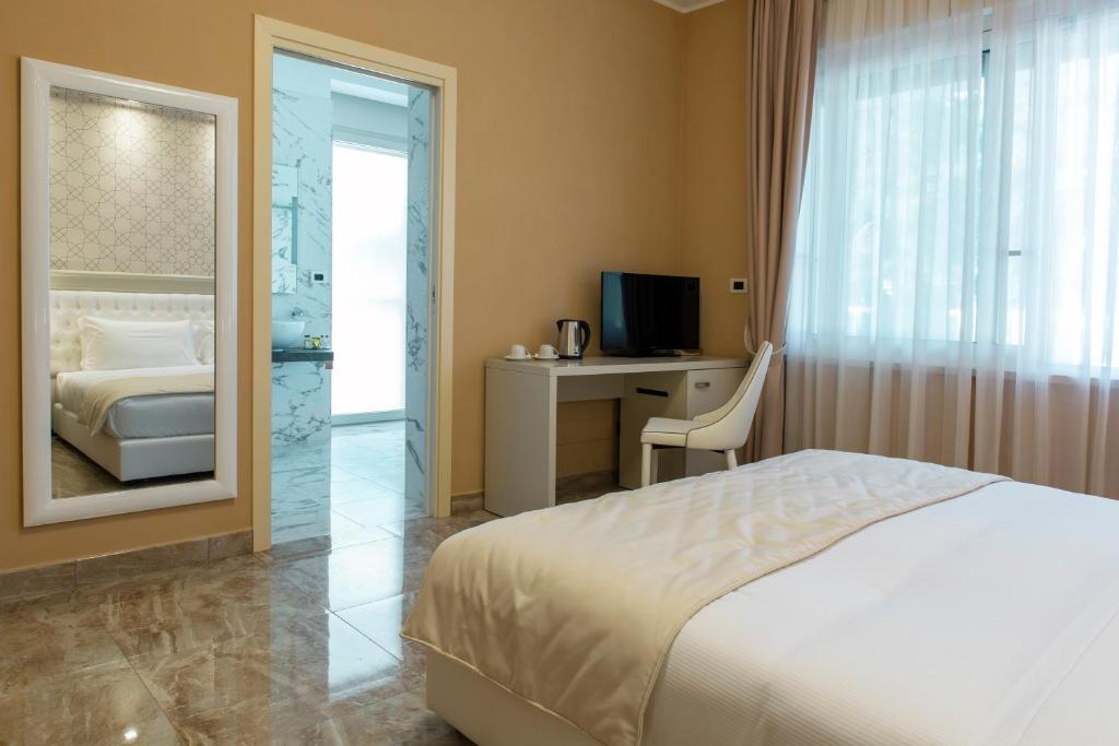 Postel nebo postele na pokoji v ubytování Aurum Suites