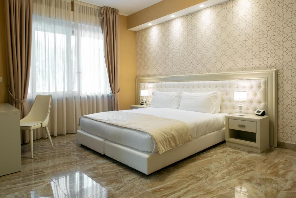 Postel nebo postele na pokoji v ubytování Aurum Suites