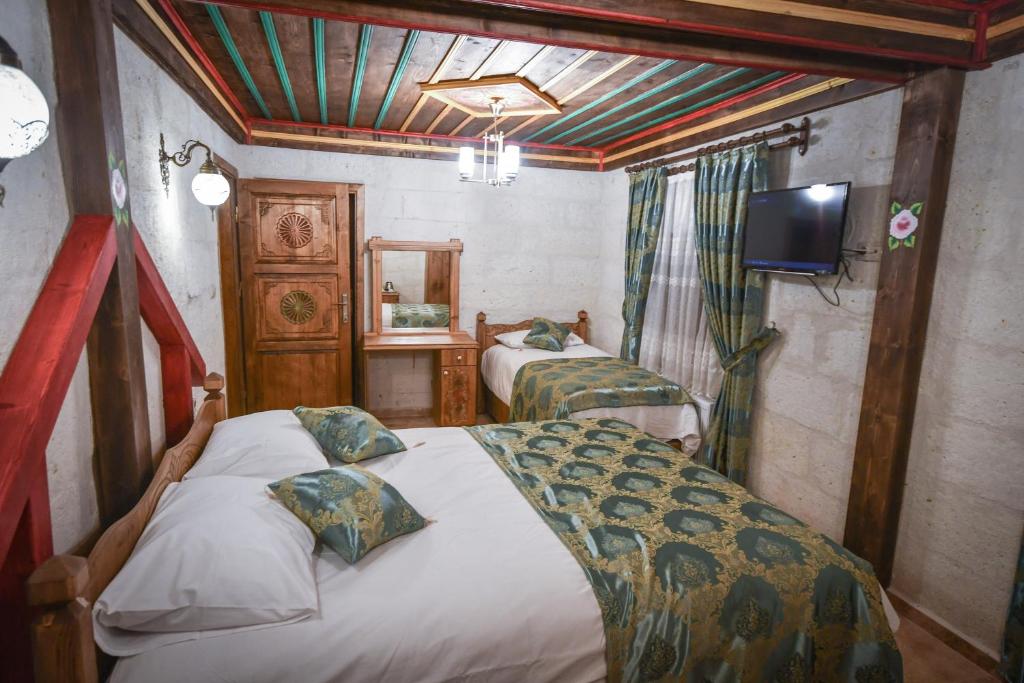 Postel nebo postele na pokoji v ubytování Cappadocia sightseeing Hotel