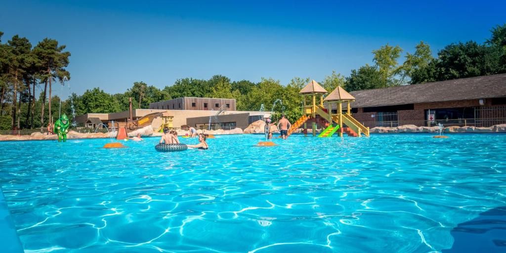 a group of people playing in a swimming pool at Familiepark Goolderheide in Bocholt