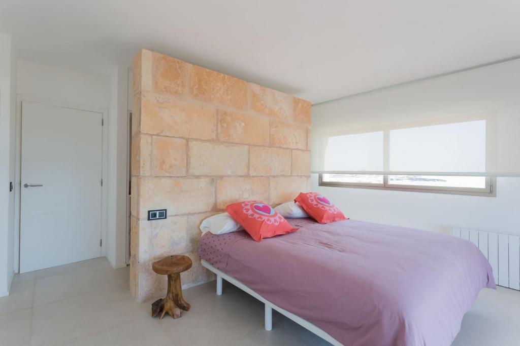 Postel nebo postele na pokoji v ubytování Maison Ses Covetes