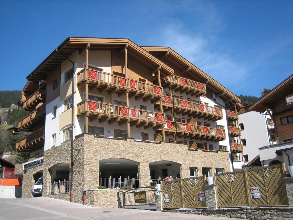 a building with balconies on the side of it at Residence Saalbach by VAYA in Saalbach Hinterglemm