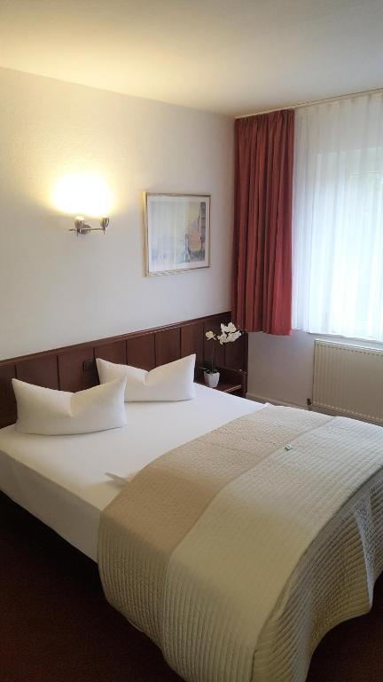 Voodi või voodid majutusasutuse Hotel "Am Fischhof" toas