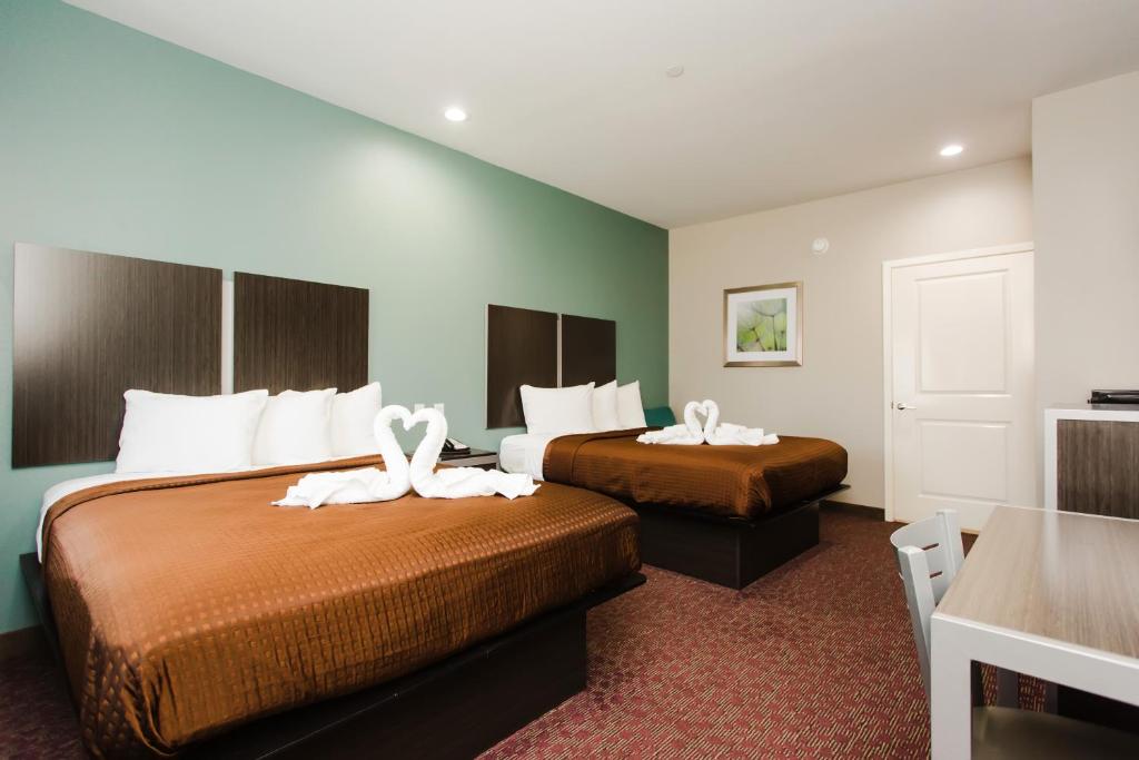 Postel nebo postele na pokoji v ubytování Express Inn - Spring