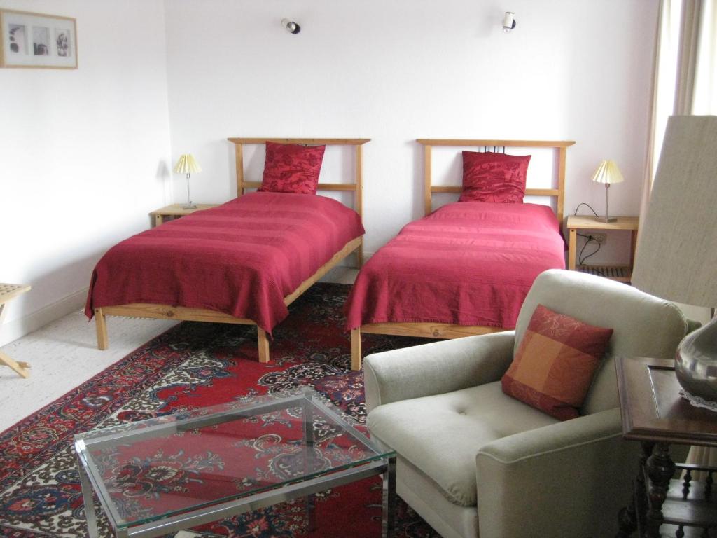 En eller flere senger på et rom på Gästehaus am Krähenteich