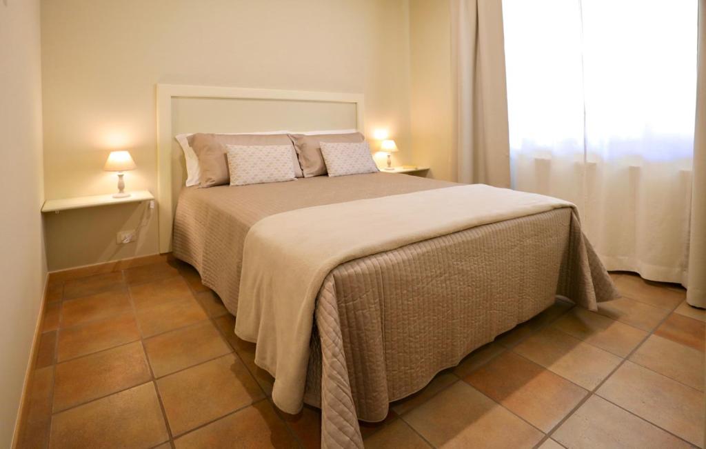 Postel nebo postele na pokoji v ubytování LE SETTE VIE HOLIDAY HOMES