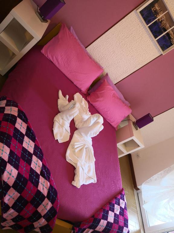 Een bed of bedden in een kamer bij B&B MANITO