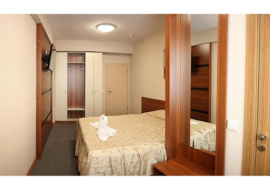 Postel nebo postele na pokoji v ubytování Hotel Ambasador